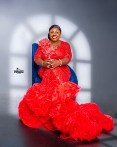 Red sequin gown with a cascading organza ruffle train.