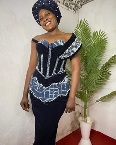 Velvet corset gown with an ndop peplum, pearl edging and a matching headwrap.